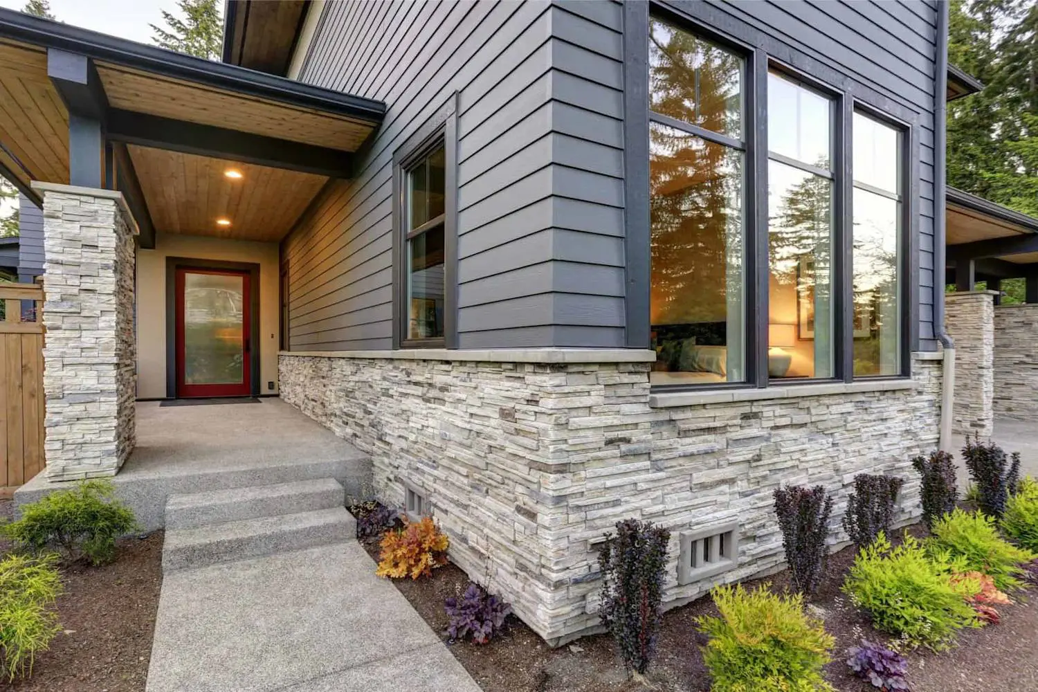 Modern Ottawa home with gray siding and stone accent wall